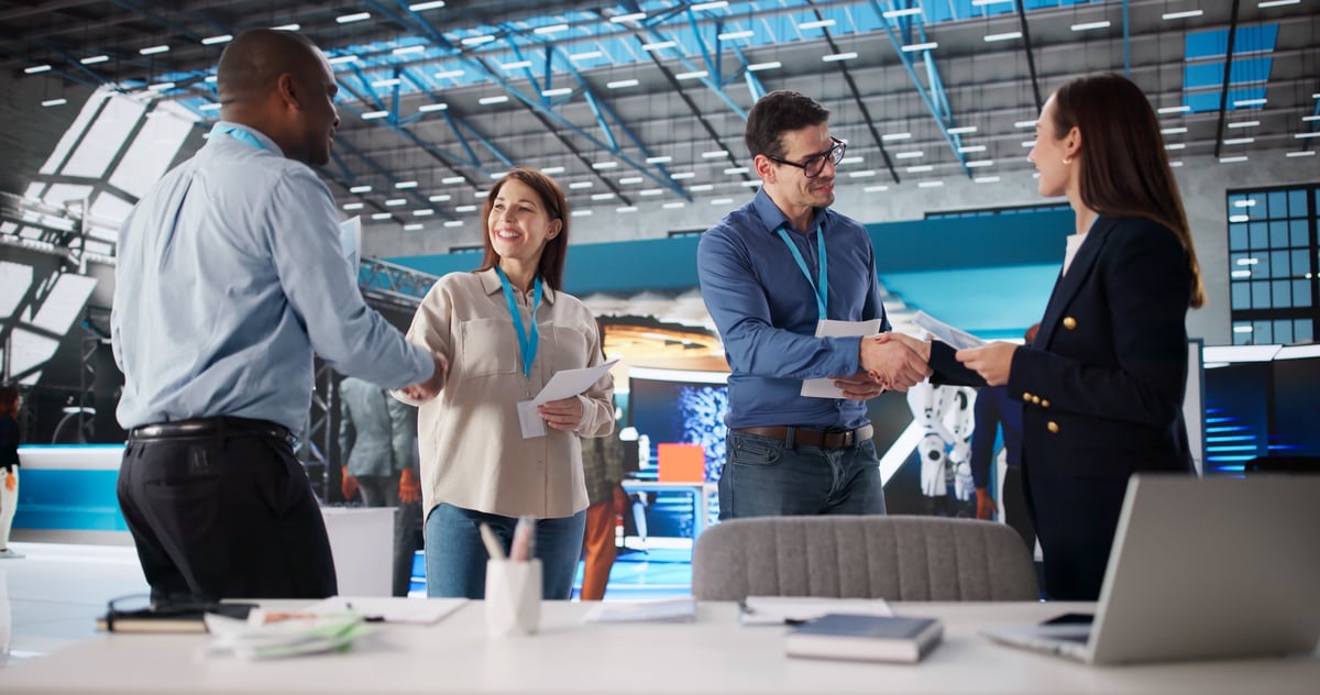 Diverse group of corporate team members at international business fair