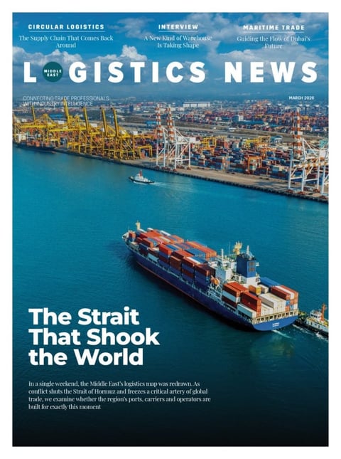 Logistics News magazine cover featuring an aerial view of a large cargo ship loaded with containers at a port facility with yellow cranes and blue water
